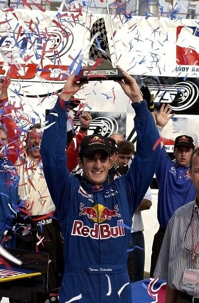 2002 IRL Michigan, 28 July, 2002 Tomas Scheckter holds trophy after his win at