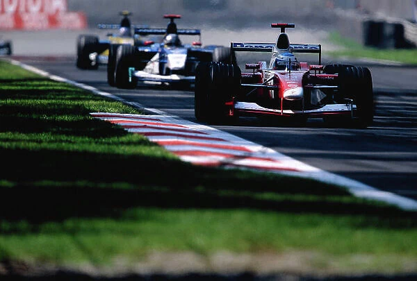 2002 Italian Grand Prix Monza, Italy. 14th - 16th September 2002 Mika Salo, Toyota TF102, leads Nick Heidfeld, Sauber Petronas C21. World Copyright - LAT Photographic ref: 35mm Transparency 02_ITA_15