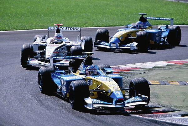 2002 Italian Grand Prix Monza, Italy. 14th - 16th September 2002 Jenson Button, Renault R202, leads Olivier Panis, BAR Honda 004, and Jarno Trulli, Renault R202. World Copyright - LAT Photographic ref: 35mm Transparency 02_ITA_11