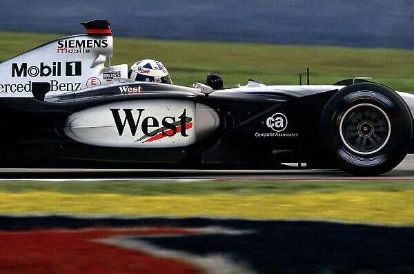 2002 Malaysian Grand Prix Sepang, Malaysia. 15th - 17th March 2002. David Coulthard, McLaren Mercedes MP4-17, action. World Copyright: Steven Tee / LAT Photographic ref: 35mm Image A69