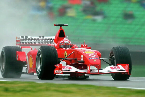 2002 San Marino Grand Prix - Friday Practice Imola, Italy. 12th April 2002. Michael Schumacher, Ferrari F2001, action. World Copyright - LAT Photographic ref: Digital Image Only