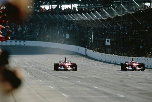 2002 United States Grand Prix Indianapolis, America. 27th - 29th eptember 2002. As Michael Schumacher, Ferrari F2002, slows, team mate Rubens Barrichello