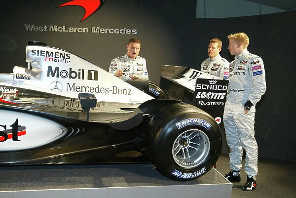 2002 West McLaren Mercedes Launch Kimi Raikkonen and David Coulthard with the new MP4-17 Circuit de Catalunya, Barcelona, Spain. 19th January 2002 World Copyright - Jennings / LAT Photographic ref: 11.7 MB Digital Image