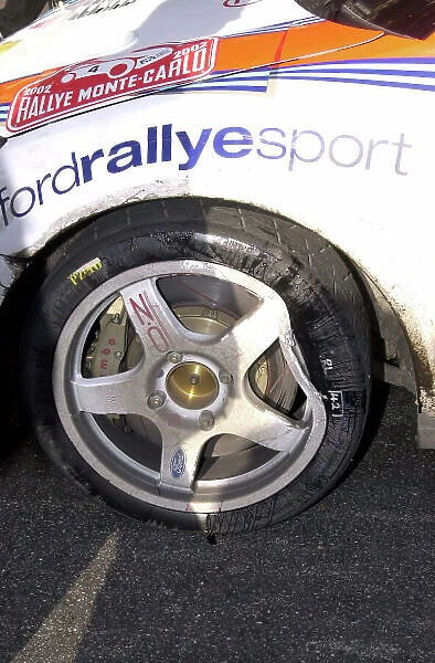 2002 World Rally Championship Monte Carlo Rally, 17-20 January 2002. Wheel damage to Carlos Sainz's Focus Photo: Ralph Hardwick / LAT
