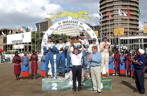 2002 World Rally Championship. Safari Rally, Nairobi Kenya, July 11-14th. Malcolm Wilson receves the manufacturers trophy. Photo: Ralph Hardwick / LAT