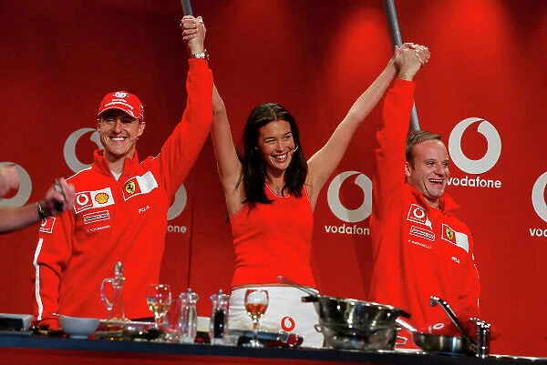 2003 Australian Grand Prix Albert Park, Melbourne, Australia. 6th March 2003. A Vodafone sponsored Ready Steady Cook sees Ferrari team mates Michael Schumacher and Rubens Barrichello, Ferrari F2002