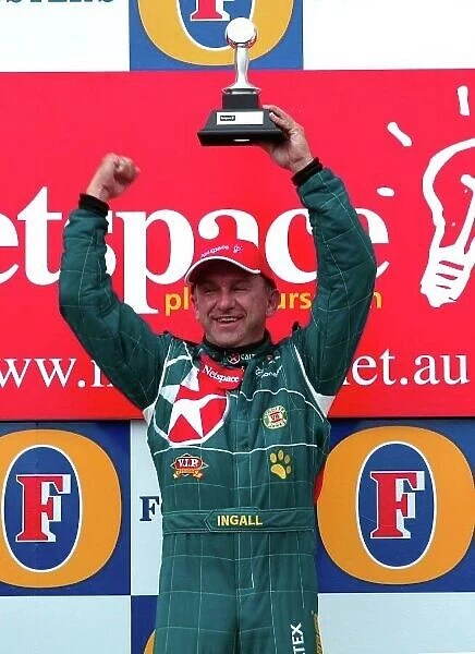 2003 Australian V8 Supercars Melbourne Grand Prix, Victoria, Australia 9th March 2003 Ford driver Russell Ingall on the podium after winning race 2 of the V8 Supercars at the 2003 Australian GP. World Copyright: Mark Horsburgh / LAT Photographic ref