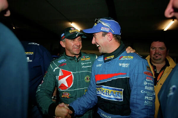 2003 Australian V8 Supercars Oran Park, Sydney, Australia. 17th August 2003. Ford driver Marcos Ambrose is congratulated by team mate Russell Ingall after taking pole for the 300km race at Sydneys Oran Park