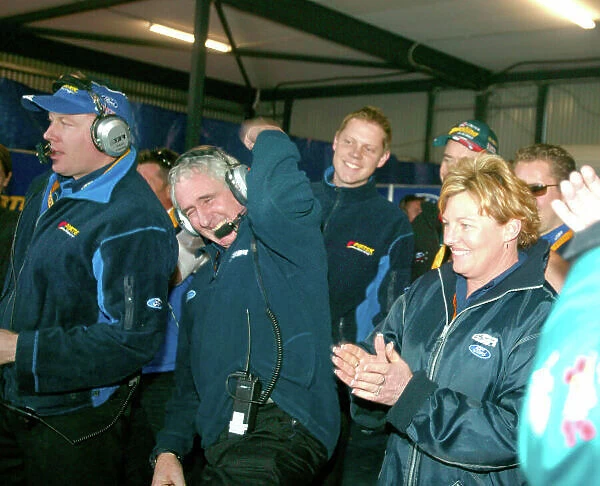 2003 Australian V8 Supercars Oran Park, Sydney, Australia. 17th August 2003. Stone Brothers Racing owner Jimmy Stone punches the air as Marcos Ambrose take pole by .62sec over Murphy at Sydneys Oran Park