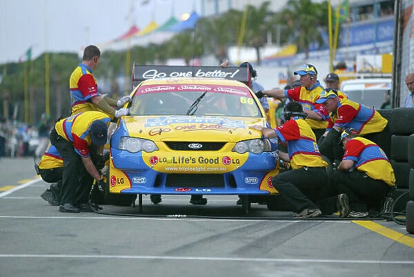 2003 Australian V8 Supercars Surfers Paradise, Australia. October 25th 2003. The Triple Eight racing crew get to work on Dean Canto's Ford Falcon. World Copyright: Mark Horsburgh / LAT Photographic ref: Digital Image Only