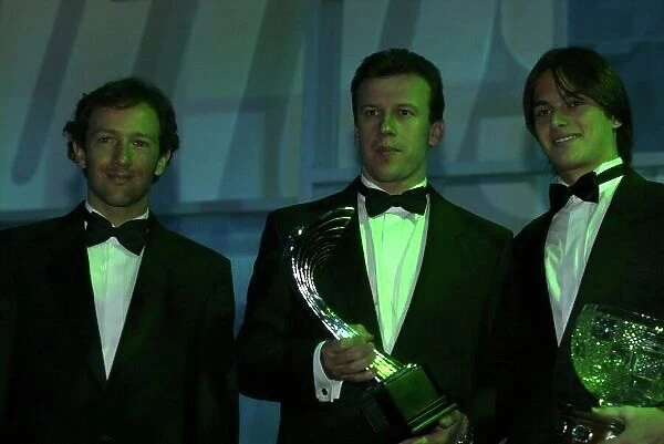 2003 AUTOSPORT AWARDS, The Grosvenor, London. 7th December 2003. Toyota F1 duo, Christiano Da Matta and Olivier Panis hand Nelson Piquet Jnr the Paul Warwick trophy for National Driver