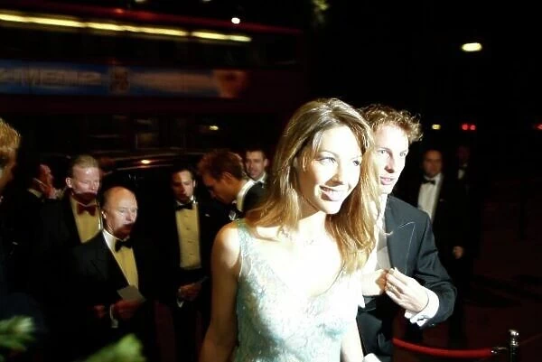 2003 AUTOSPORT AWARDS, The Grosvenor, London. 7th December 2003. Jenson Button arrives with girlfriend, Louise Griffiths. Photo: Peter Spinney / LAT Photographic Ref: Digital Image only