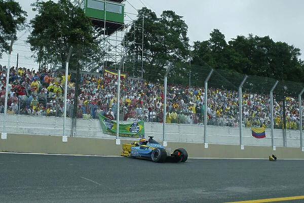 2003 Brazilian Grand Prix - Sunday Race Interlagos, Brazil. 6th April 2003. Fernando Alonso, Renault R23, crashes into the wall. World Copyright LAT Photographic. ref: Digital Image Only