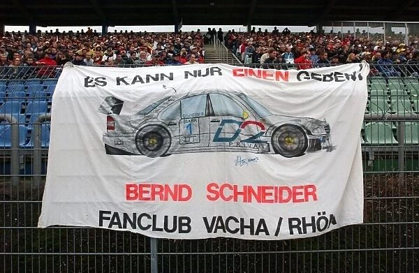 DTM. 2003 DTM Champion, Bernd Schneider (GER), Vodafone AMG Mercedes Benz, fan flag.