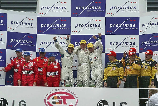 2003 FIA GT Championship Spa 24 Hours, Spa Francorchamps, Belgium, 26th - 27th July 2003. Race podium - Ortelli / Lieb / Dumas (Porsche 996 GT3-RS) 1st, Cappellari / Gollin / Bryner / Calderari (Ferarri 550 Maranello)