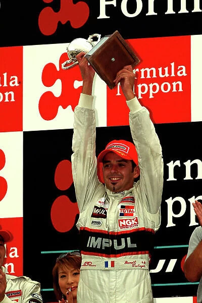 2003 Formula Nippon Championship Fuji, Japan. 31st August 2003. Race winner Benoit Treluye (IMPUL), podium. World Copyright: Yasushi Ishihara / LAT Photographic ref: Digital Image Only