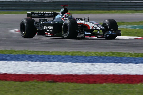 2003 Malaysian Grand Prix - Friday practice. Sepang, Malaysia. 20th March 2003 Justin Wilson, Minardi PS03, action. World copyright LAT Photographic