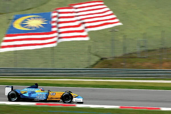 2003 Malaysian Grand Prix - Friday practice. Sepang, Malaysia. 20th March 2003 Jarno Trulli, Renault R23, action. World copyright LAT Photographic