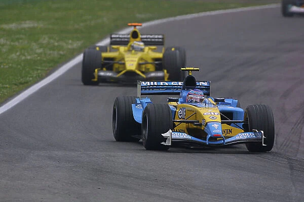 2003 San Marino Grand Prix - Sunday Race, Imola, Italy. 20th April 2003. Jarno Trulli, Renault R23, leads Giancarlo Fisichella, Jordan Ford EJ13, action. World Copyright LAT Photographic. ref: Digital Image Only