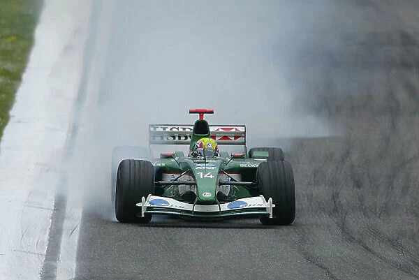 2003 San Marino Grand Prix - Sunday Race, Imola, Italy. 20th April 2003. Mark Webber, Jaguar R4, locking up. World Copyright LAT Photographic. ref: Digital Image Only