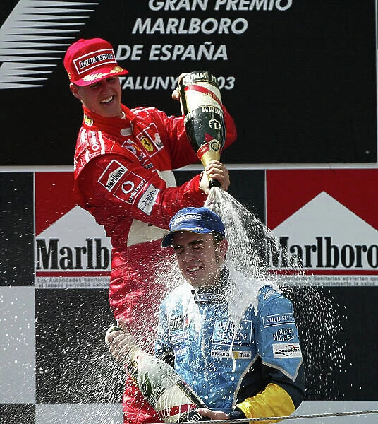 2003 Spanish Grand Prix - Sunday Race, 2003 Spanish Grand Prix Barcelona, Spain. 4th May 2003 Michael Schumacher, Ferrari F2003 GA, sprays Fernando Alonso, Renault R23
