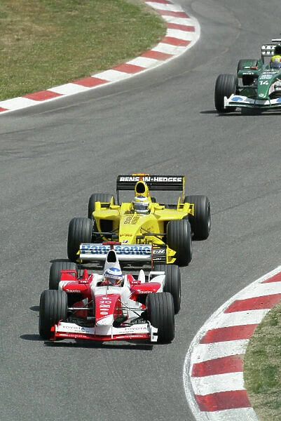 2003 Spanish Grand Prix - Sunday Race, Barcelona, Spain. 4th May 2003. Olivier Panis, Toyota TF103, leads Giancarlo Fisichella, Jordan Ford EJ13, action. World Copyright LAT Photographic. ref: Digital Image Only