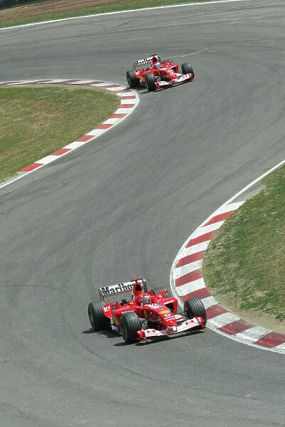 2003 Spanish Grand Prix - Sunday Race, Barcelona, Spain. 4th May 2003. Michael Schumacher, Ferrari F2003 GA, leads Rubens Barrichello, Ferrari F2003 GA, action. World Copyright LAT Photographic. ref: Digital Image Only