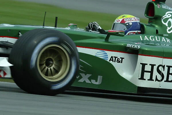 2003 United States Grand Prix - Friday Qualifying, Indianapolis, USA. 26th September 2003. Mark Webber, Jaguar R4, action. World Copyright LAT Photographic. Digital Image Only