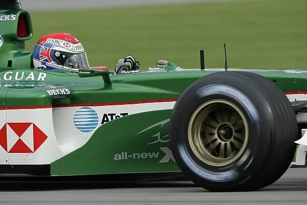 2003 United States Grand Prix - Friday Qualifying, Indianapolis, USA. 26th September 2003. Justin Wilson, Jaguar R4, action. World Copyright LAT Photographic. Digital Image Only