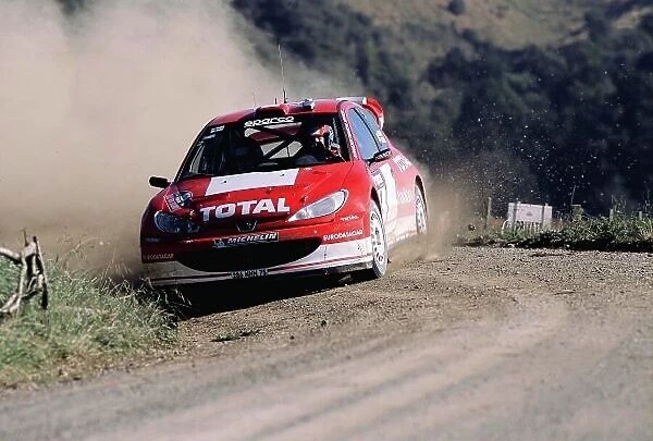 2003 World Rally Championship Rally New Zealand. 9th - 13th April 2003. Rally winner Marcus Gronholm / Timo Rautiainen (Peugeot 206 WRC), action. World Copyright: McKlein / LAT Photographic ref: 35mm Image A05