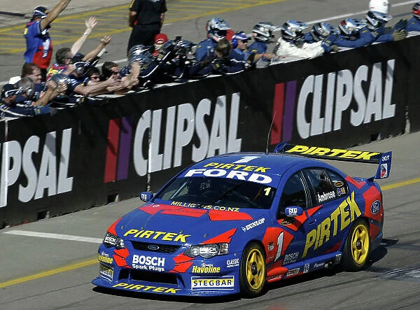 2004 Australian V8 Supercar Championship Clipsal 500, Adelaide, Australia. 21st March 2004. Ford driver Marcos Ambrose crosses the finish line in front of his crew after winning the opening round at the Clipsal 500