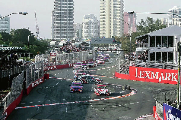 2004 Australian V8 Supercars Surfers Paradise, Australia. 21st - 24th October 2004 Marcus Ambrose (Ford Falcon BA) and Mark Skaife (Holden Commodore VY), cut the corner at the start of Race 1, as Russell Ingall spins