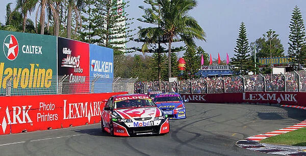 2004 Australian V8 Supercars Surfers Paradise, Australia. 21st - 24th October 2004 Mark Skaife (Holden Commodore VY) leads Marcus Ambrose (Ford FalconBA), action. World Copyright: Mark Horsburgh / LAT Photographic ref: Digital Image Only