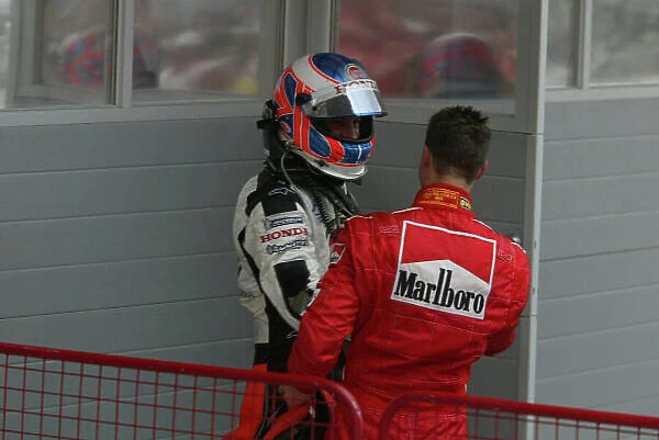 2004 Bahrain Grand Prix - Sunday race, Sakhir, Bahrain. 4th April 2004 Michael Schumcaher, Ferrari F2004, congratulates Jenson Button, BAR Honda 006 on his result. World Copyright LAT Photographic. Digital image only