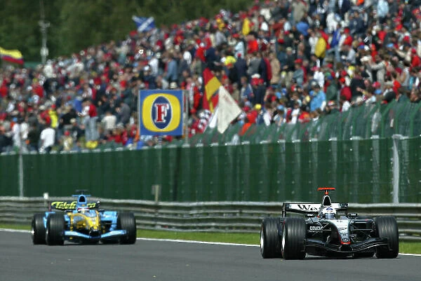 2004 Belgian Grand Prix-Sunday Race, Spa-Francorchamps, Belgium. 29th August 2004. David Coulthard, McLaren Mercedes MP4 / 19B leads Fernando Alonso, Renault R24, action. World Copyright LAT Photographic