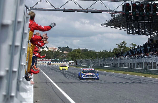 2004 DTM Championship Estoril, Portugal. 1st - 2nd May 2004. Martin Tomczyk (Abt Sportsline Audi A4) crosses the finish line to take 3rd position ahead of Tom Kristensen (Abt Sportsline Audi A4)