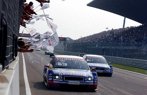 2004 DTM Championship Zandvoort, Netherlands. 4th - 5th September. Mattias Ekstrom (Abt Sportsline Audi A4) and Martin Tomczyk (Abt Sportsline Audi A4) cross the finish line for an Abt Audi 1-2 to the cheers of their team. Action