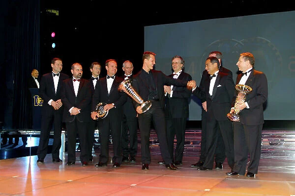 2004 FIA Awards Dinner Monte Carlo, Monaco. 11th December 2004 The Ferrari team fool around as they accept their trophies. World Copyright: Malcolm Griffiths / LAt Photographic ref: Digital Image Only