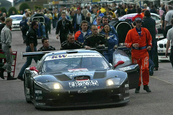 2004 FIA GT Championship Donington Park, England. June 26th - 27th Wendlinger / Melo (Ferrari 575M Maranello) get a push from mechanics in the pit lane. World Copyright: Photo4 / LAT Photographic ref: Digital Image Only