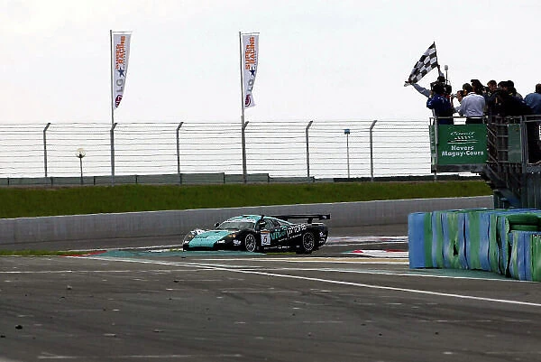 2004 FIA GT Championship Magny-Cours, France. 1st - 2nd May 2004. Race winner Michael Bartels / Uwe Alzen (Saleen S7), takes the chequered flag. World Copyright: Photo4 / LAT Photographic ref: Digital Image Only