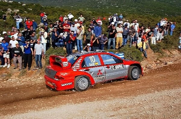 2004 FIA World Rally Championship: Daniel Sola, Mitsubishi Lancer WRC 04, in action on Stage 10, running under the new SUPERally system