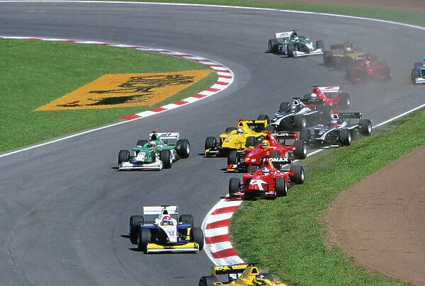 2004 Formula 3000 Championship (F3000) Barcelona, Spain. May 7th - 8th. Robert Doornbos (Arden International) runs onto the grass as the rest of the field go through turn one. World Copyright:Peter Spinney / LAT Photographic ref: 35mm Image A18