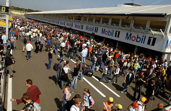2004 German Tourng Car (DTM) Championship Hockenheim, Germany, 18th April 2004 Spectators gather for the pit lane walk about. World Copyright: Irlmeier / LAT Photographic ref: Digital Image Only © Andre Irlmeier  / LAT