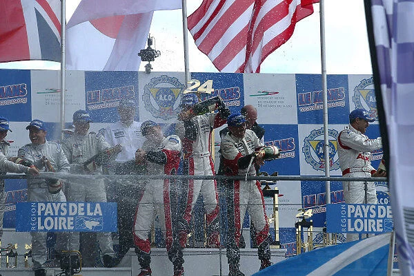 2004 Le Mans 24 Hours 12th - 1th June. Le Mans, France. The podium champagne fight commences. World Copyright: John Tingle  /  LAT Photographic ref: Digital Image Only