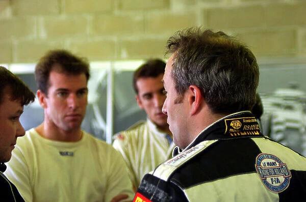 2004 Le Mans Pre-Qualifying, La Sarthe, France. 23rd - 25th April. Racing for Holland Dome / Judd team mates Ralf Firman and Justin Wilson talk to Tom Coronel in the garage. World Copyright: Brooks / LAT Photographic ref: Digital Image only