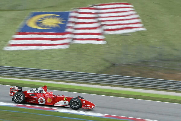 2004 Malaysian Grand Prix-Friday practice, Sepang, Malaysia. 19th March 2004 Michael Schumcaher, Ferrari F2004, action. World copyright LAT Photographic. Digital image only