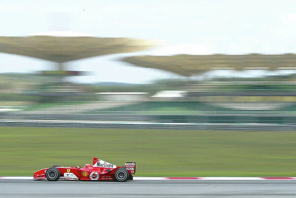 2004 Malaysian Grand Prix-Friday practice, Sepang, Malaysia. 19th March 2004 Michael Schumcaher, Ferrari F2004, action. World copyright LAT Photographic. Digital image only
