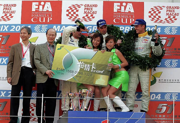 2004 SJM Guia Race Circult de Guia, Macau. 18th-21st November 2004. World Copyright:LAT. Digital Image Only. The Guia race winner douse the EC Card girls with Champagne. PHOTO: CGPM