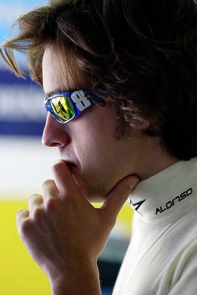 2004 Spanish Grand Prix - Friday Circuit de Catalunya, Barcelona, Spain. 7th - 9th May. Fernando Alonso, Renault R24 in the pits, thinking about a trying to put on a good performance for his Spanish fans. Portrait