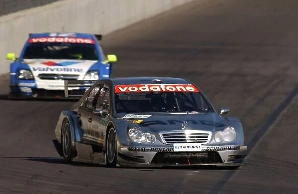 2005 DTM Championship Lausitz, Germany. 17th - 18th September 2005 Jean Alesi (AMG-Mercedes C-Klasse) leads Manuel Reuter (Opel Vectra GTS V8). Action. World Copyright: Andre Irlmeier  /  LAT Photographic ref: Digital Image Only